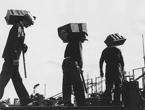 Workers carry brick to the PWA construction site of Teaneck High School in New Jersey. Courtesy of Library of Congress