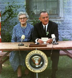 Lyndon B. Johnson at the ESEA signing ceremony, with his childhood schoolteacher Ms. Kate Deadrich Loney