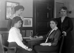 Julia Lathrop, Head of Children's Bureau, Labor Department, with Assistants