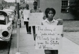 Sandy Stokes walks down Main Street in Farmville to protest school closures in July of 1963. Photo courtesy of VCU Libraries.