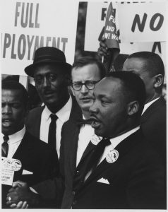 Dr. Martin Luther King, Jr., President of the Southern Christian Leadership Conference, and Mathew Ahmann, Executive Director of the National Catholic Conference for Interrracial Justice, in a crowd.