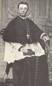 Bishop James Augustine Healy seated in chair and wearing ecclesiastical robes