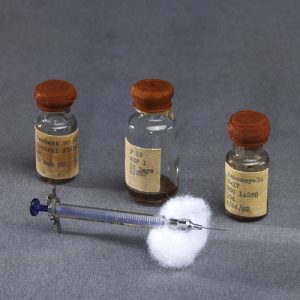 Syringe and three vials used to test the Salk polio vaccine on children