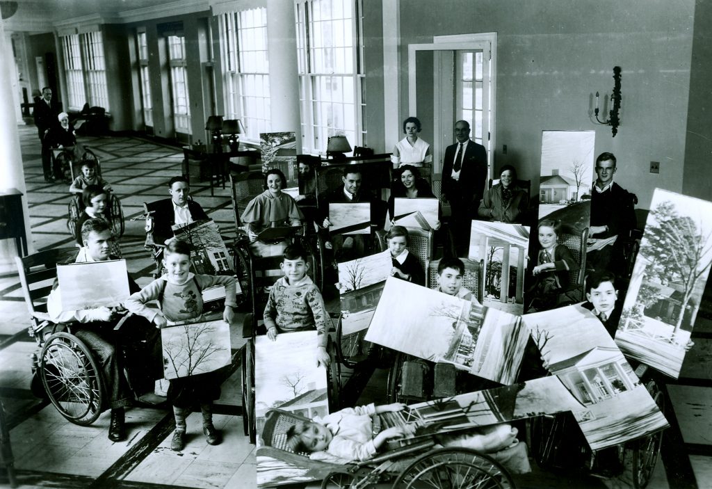 Patients at the Georgia Warm Springs Foundation holding a giant card for President Roosevelt